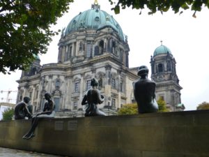 Bronze of 3 girls and a boy.